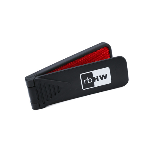 Rosebloom hat lint brush with a foldable black handle and red fabric brush surface against a light gray background.
