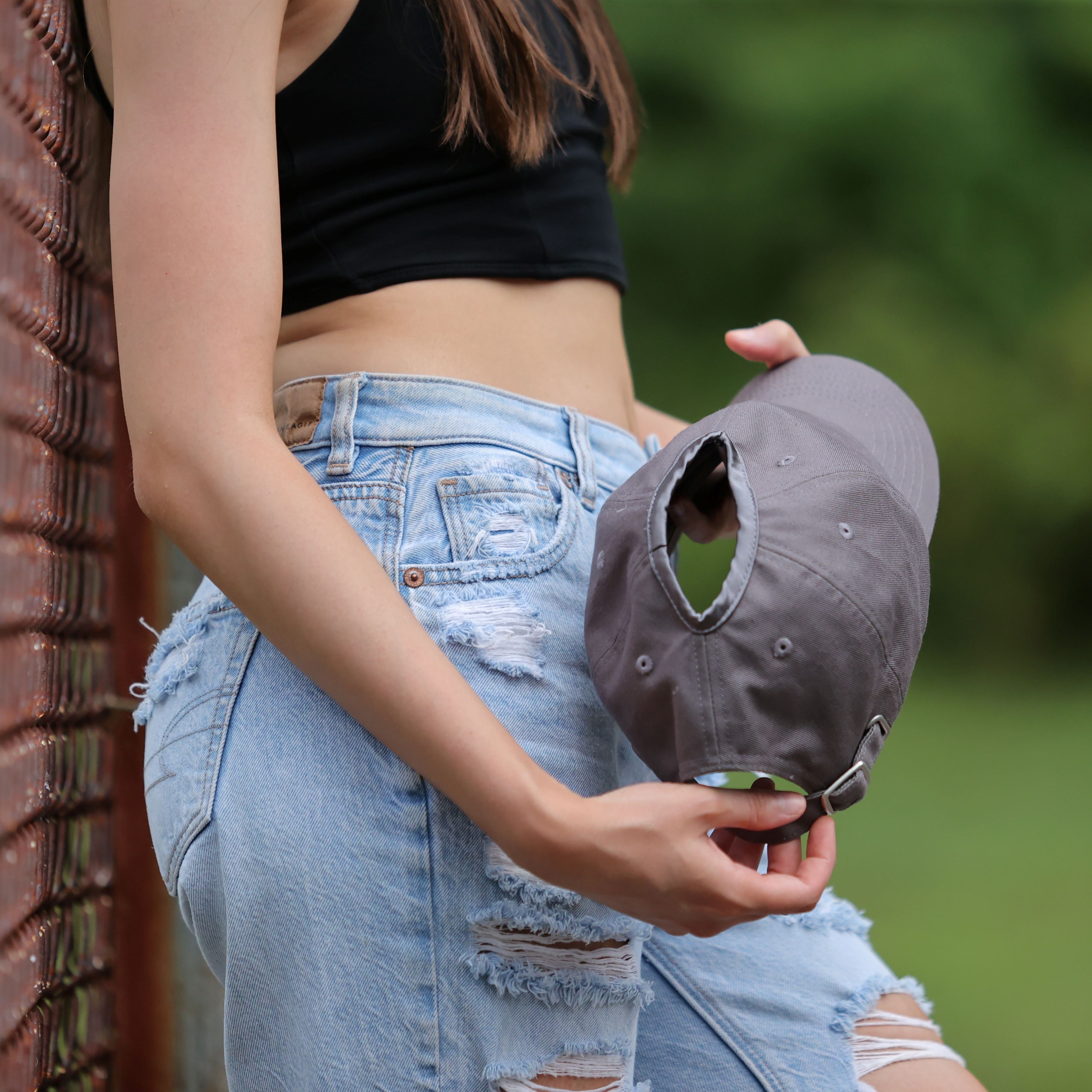 Gray Rosebloom PNT high ponytail hat showing the crown-height opening