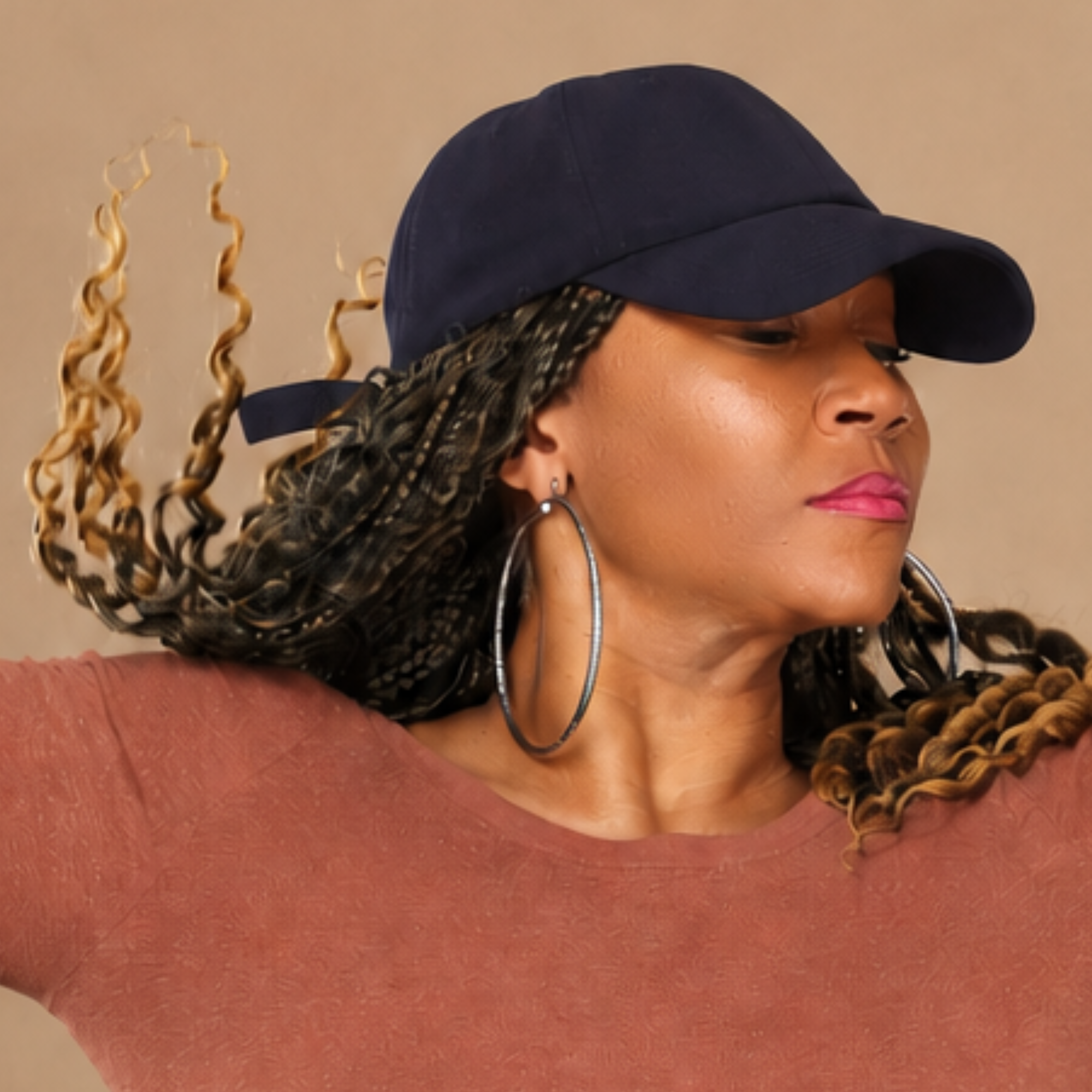 Model shown in profile wearing the navy Rosebloom HLO closed crown hat, showing room for locs, textured hair, and protective styles.