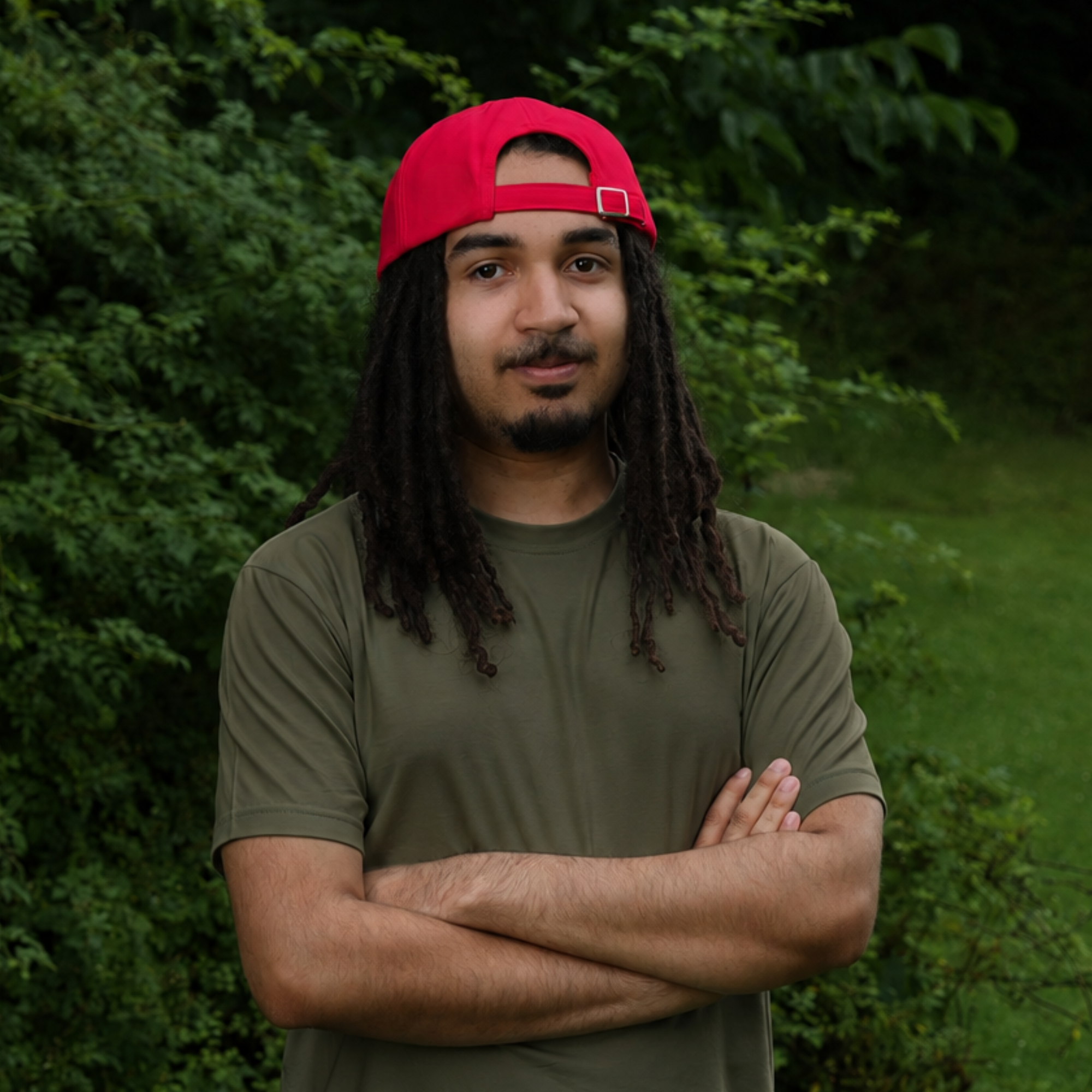 Model wearing backward the red Rosebloom HLO closed crown hat, showing room for locs, textured hair, and protective styles.
