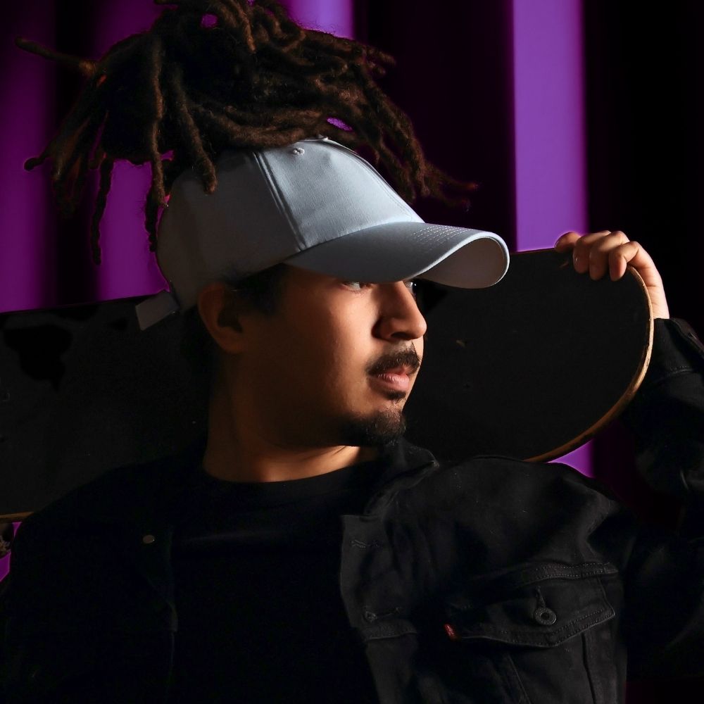 Model shown in profile wearing the baby blue Rosebloom JAX PETAL crown-height opening hat, showing room for locs, textured hair, and protective styles.