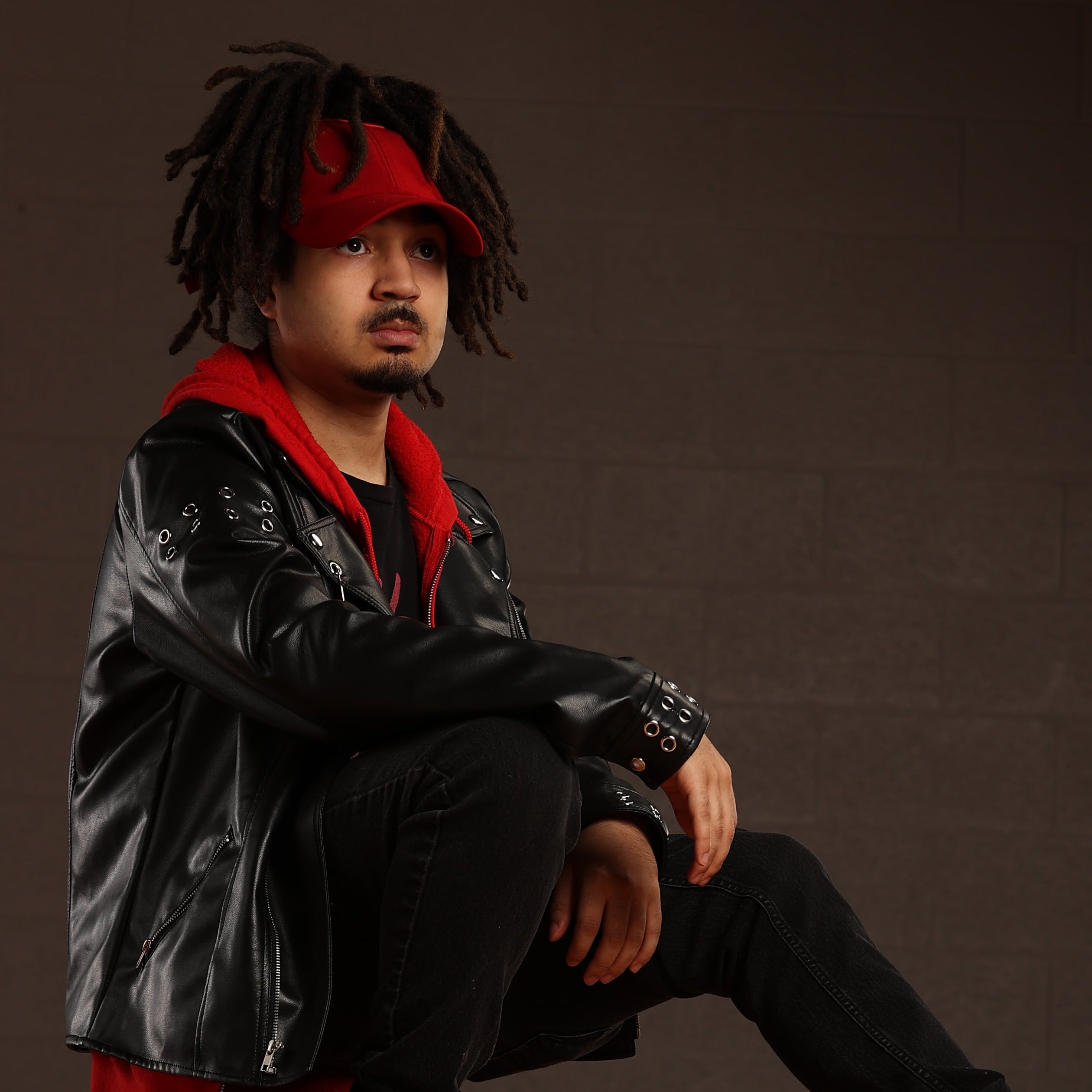Red Rosebloom JAX hat shown at an angle, featuring the COROLLA Hair+ fit and PETAL crown-height opening.