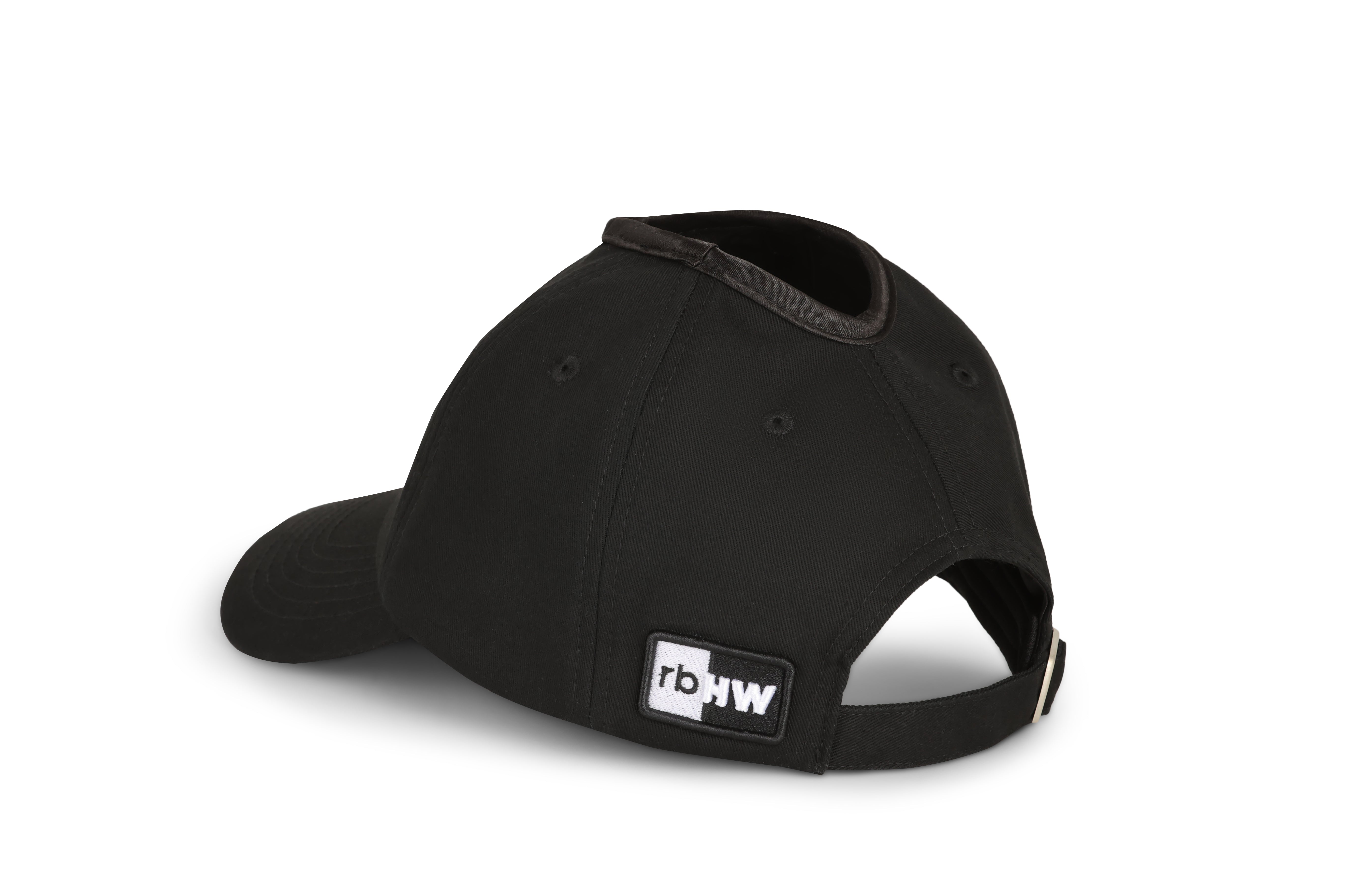 Black Rosebloom PNT ponytail hat shown from the back-left angle with crown opening
