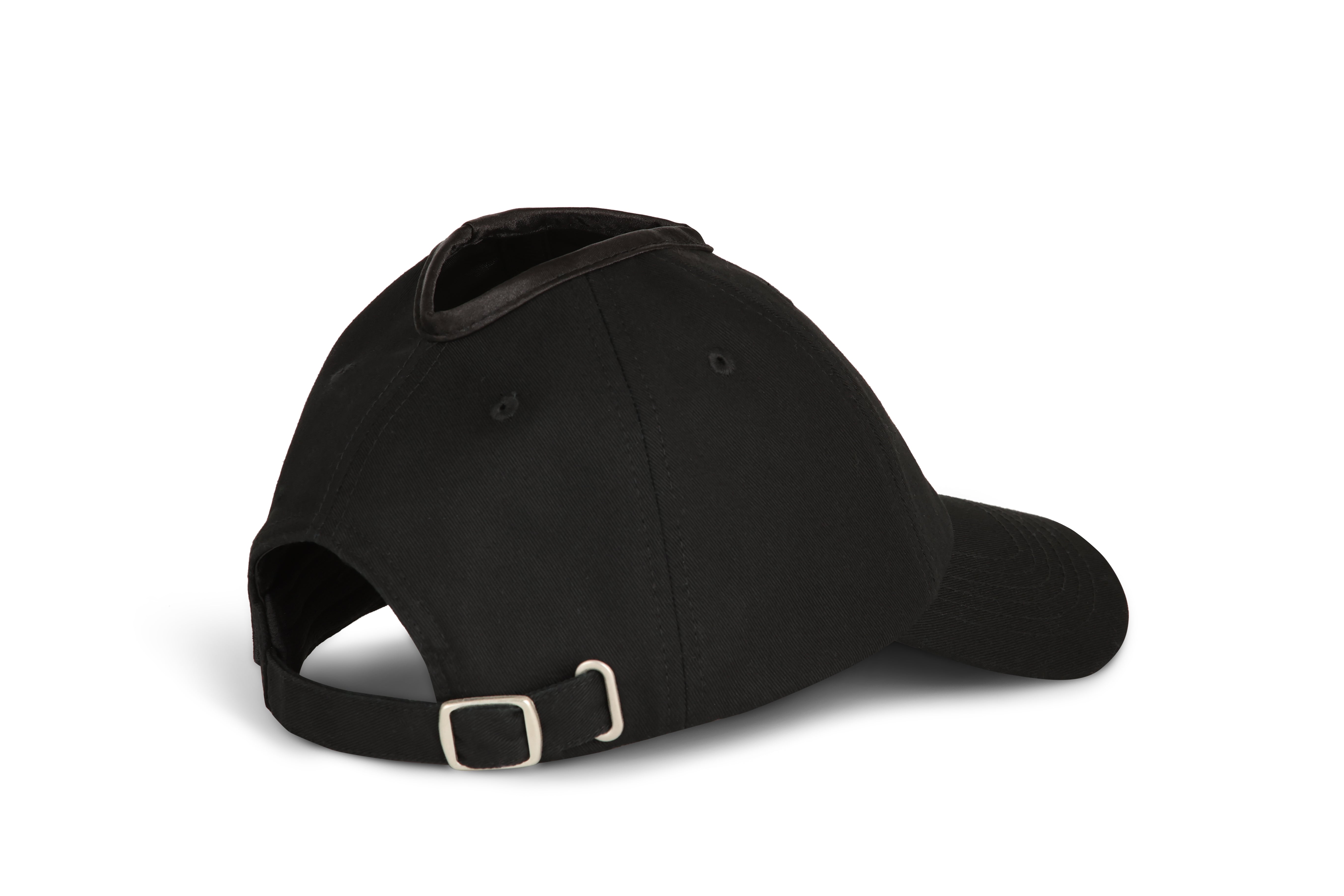 Side view of black Rosebloom PNT ponytail hat with back opening visible
