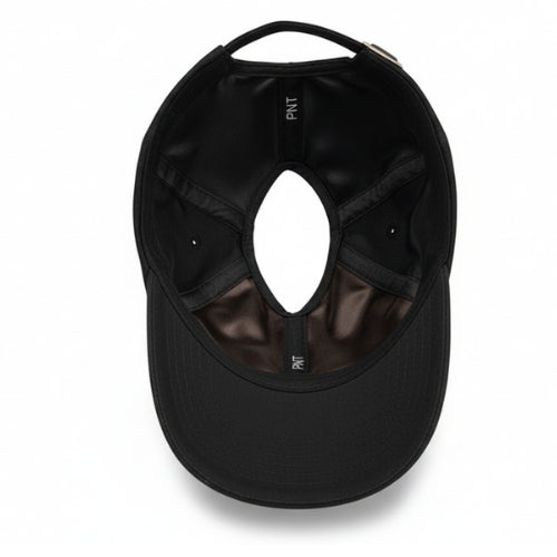 Interior of black Rosebloom PNT satin-lined ponytail hat with crown opening
