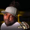 University of Utah hat for thick hair Black man with locs wears satin lined University of Utah flat bill snap back for thick hair hat