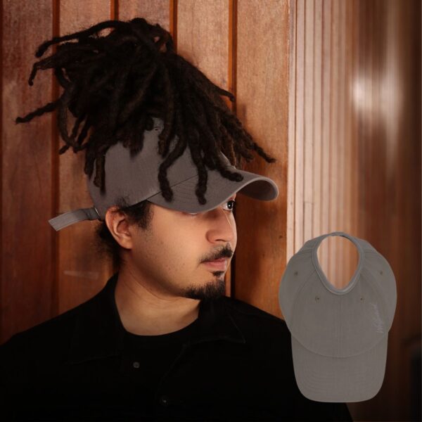 Black man wears an NC State Wolfpack satin lined high ponytail baseball hat for locs and textured hair