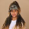 Black woman wears satin lined NC State Wolfpack stretch fit ponytail baseball hat for locs and textured hair